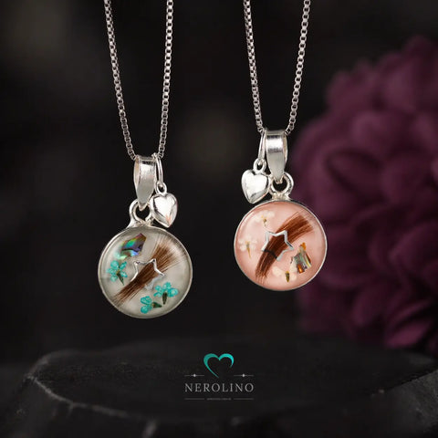 Kettenanhänger rund mit Haaren und Blüten in 925er Sterlingsilber.