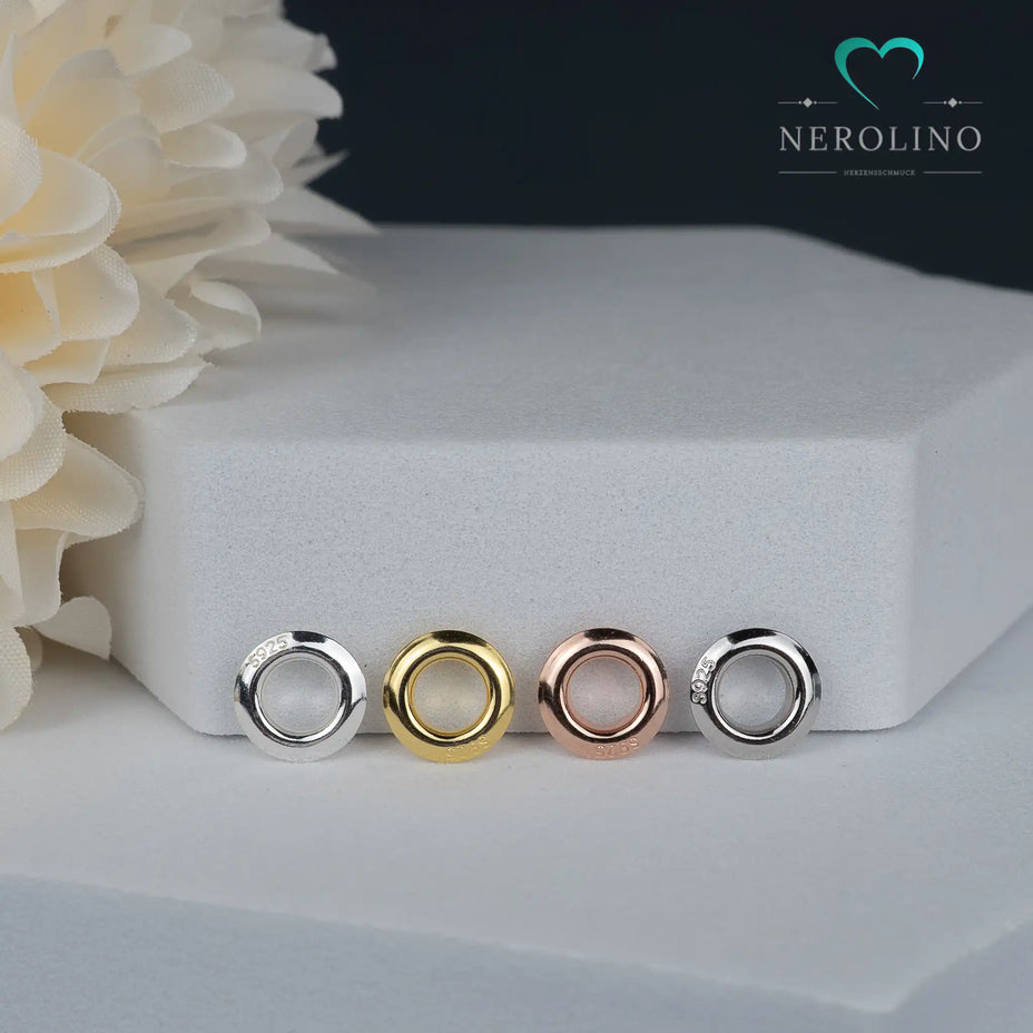 Nieten für Großlochperlen in verschiedenen Farben.