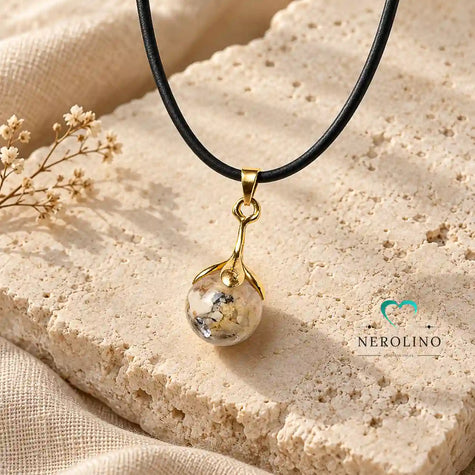 Perlennhänger mit einer Perle aus Asche in Gold.